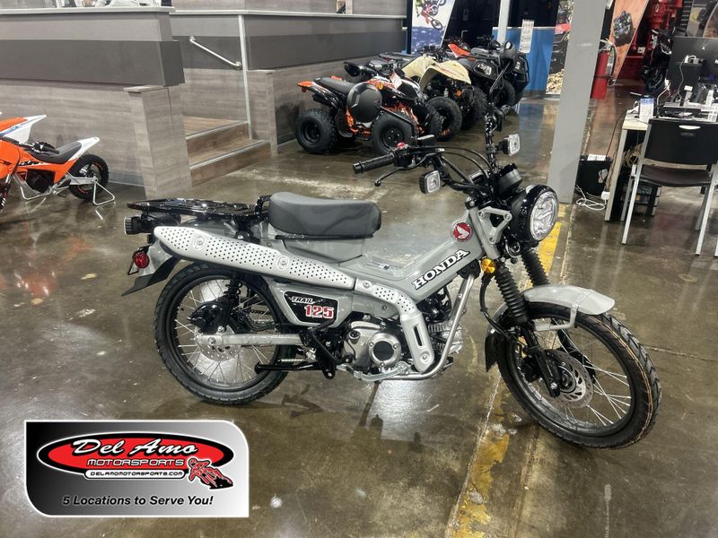 2025 Honda TRAIL 125  in a PEARL SMOKY GRAY exterior color. Del Amo Motorsports of Redondo Beach (424) 390-7811 delamomotorsports.com 
