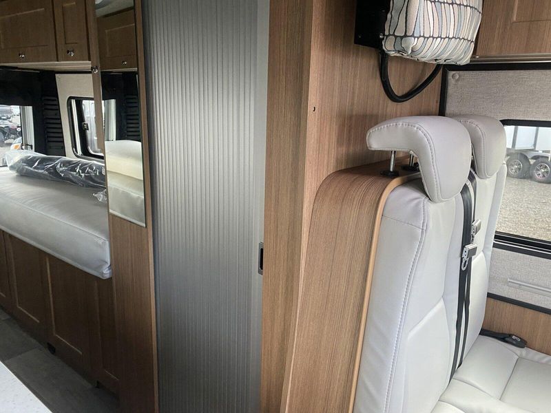 2024 ROADTREK Pivot  in a Silver Metallic exterior color and Chestnut Browninterior. Legacy Powersports 541-663-1111 legacypowersports.net 