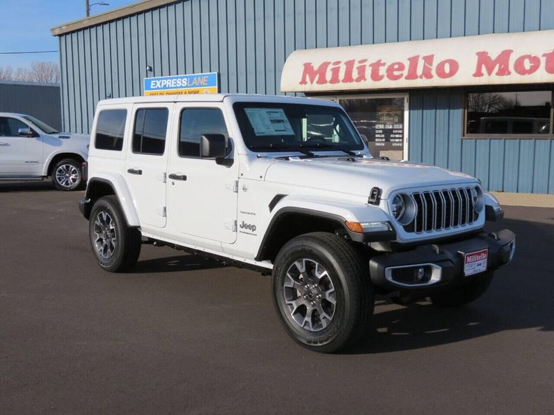 2024 Jeep Wrangler 4-door Sahara in a Bright White Clear Coat exterior color and Blackinterior. Militello Motors ​507-200-4344 militellomotors.net 