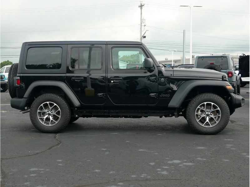 2024 Jeep Wrangler 4-door Sport S in a Black Clear Coat exterior color and Blackinterior. Paul Sherry Chrysler Dodge Jeep RAM (937) 749-7061 sherrychrysler.net 