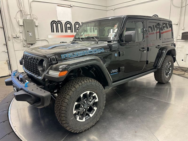 2024 Jeep Wrangler 4-door Rubicon X 4xe in a Black Clear Coat exterior color and Blackinterior. Marina Auto Group (855) 564-8688 marinaautogroup.com 