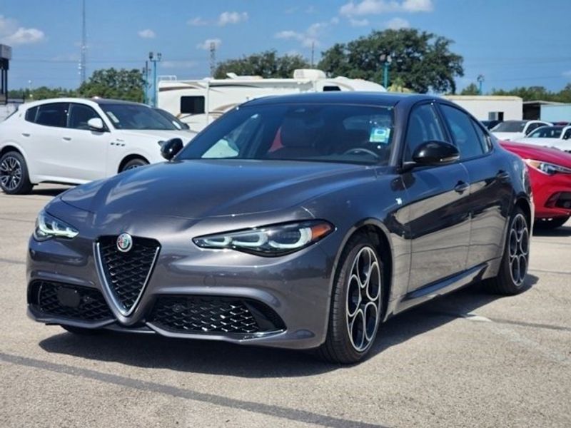 2024 Alfa Romeo Giulia Ti in a Vesuvio Gray Metallic exterior color and Blackinterior. Northside Imports Houston 281-475-4549 northsideimportshouston.com 