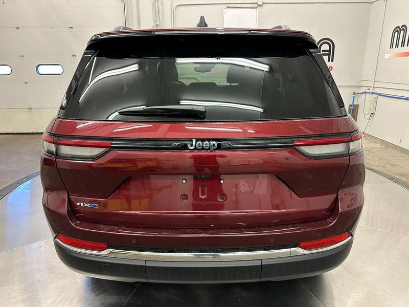 2024 Jeep Grand Cherokee 4xe in a Velvet Red Pearl Coat exterior color and Global Blackinterior. Marina Auto Group (855) 564-8688 marinaautogroup.com 