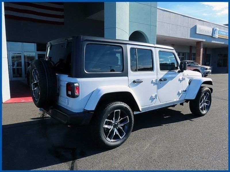 2024 Jeep Wrangler 4xE Sport S 4xe in a Bright White Clear Coat exterior color and Blackinterior. Papas Jeep Ram In New Britain, CT 860-356-0523 papasjeepram.com 