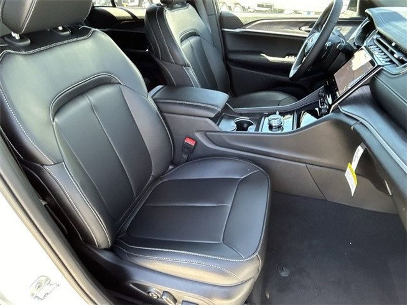 2024 Jeep Grand Cherokee Limited 4x4 in a Bright White Clear Coat exterior color. McPeek