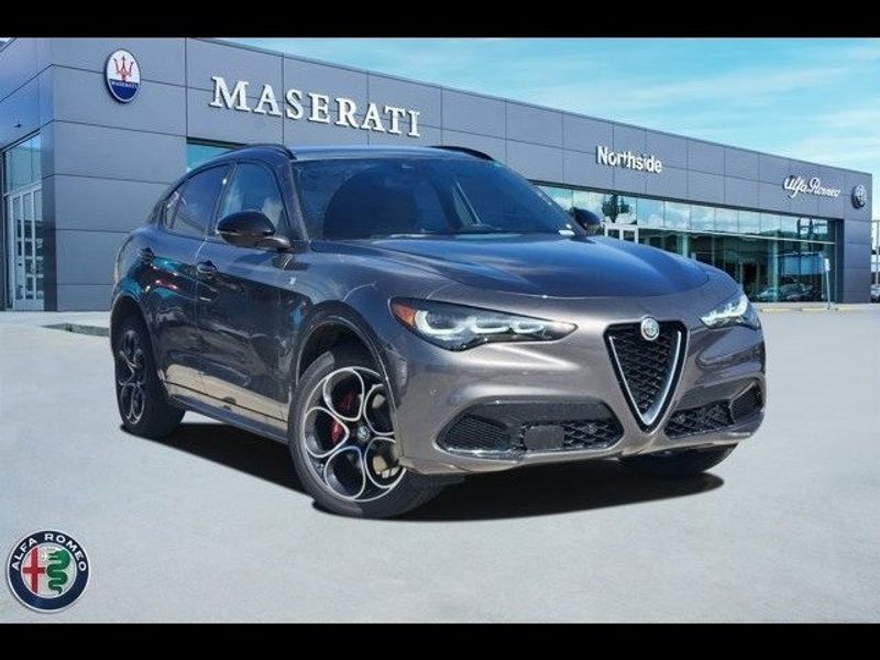 2024 Alfa Romeo Stelvio Ti Awd in a Vesuvio Gray Metallic exterior color and Chocolateinterior. Northside Alfa Romeo of Houston 281-475-4549 alfaromeousaofnorthhouston.com 