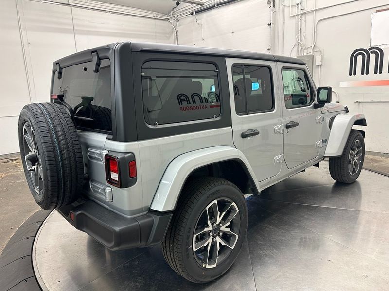 2024 Jeep Wrangler 4-door Sport S 4xe in a Silver Zynith Clear Coat exterior color and Blackinterior. Marina Auto Group (855) 564-8688 marinaautogroup.com 