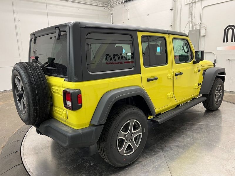 2023 Jeep Wrangler 4-door Sport S 4x4 in a High Velocity Clear Coat exterior color and Blackinterior. Marina Chrysler Dodge Jeep RAM (855) 616-8084 marinadodgeny.com 