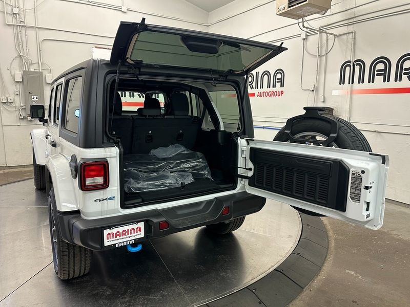 2024 Jeep Wrangler 4-door Sport S 4xe in a Bright White Clear Coat exterior color and Blackinterior. Marina Chrysler Dodge Jeep RAM (855) 616-8084 marinadodgeny.com 