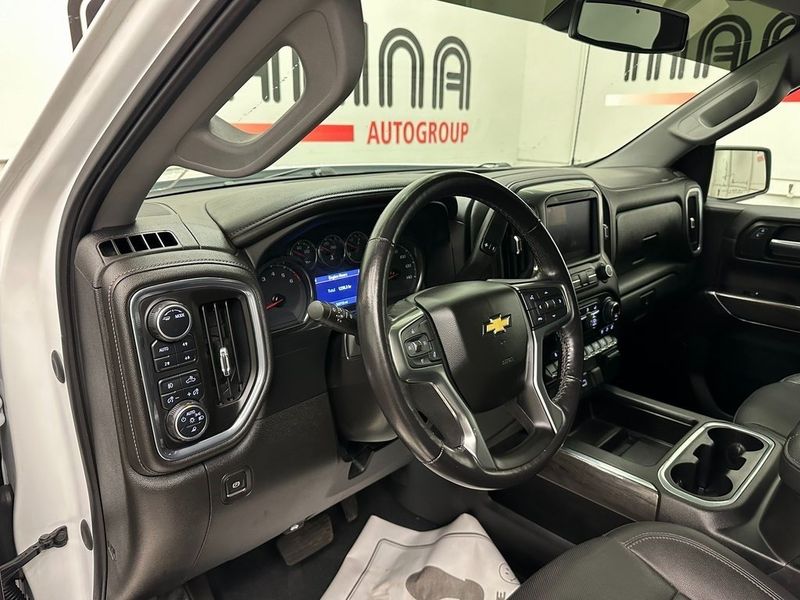 2021 Chevrolet Silverado 1500 LTZ in a Summit White exterior color and Jet Blackinterior. Marina Chrysler Dodge Jeep RAM (855) 616-8084 marinadodgeny.com 