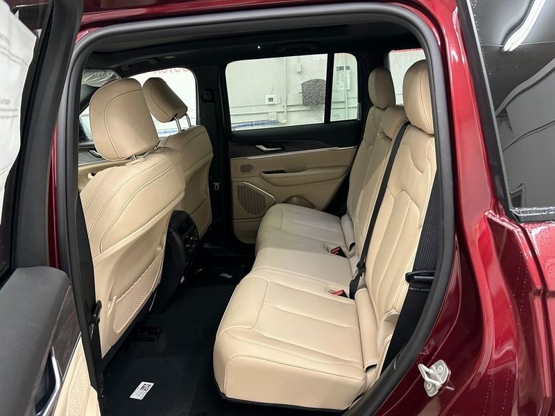 2024 Jeep Grand Cherokee 4xe in a Velvet Red Pearl Coat exterior color and Wicker Beige/Global Blackinterior. Marina Auto Group (855) 564-8688 marinaautogroup.com 