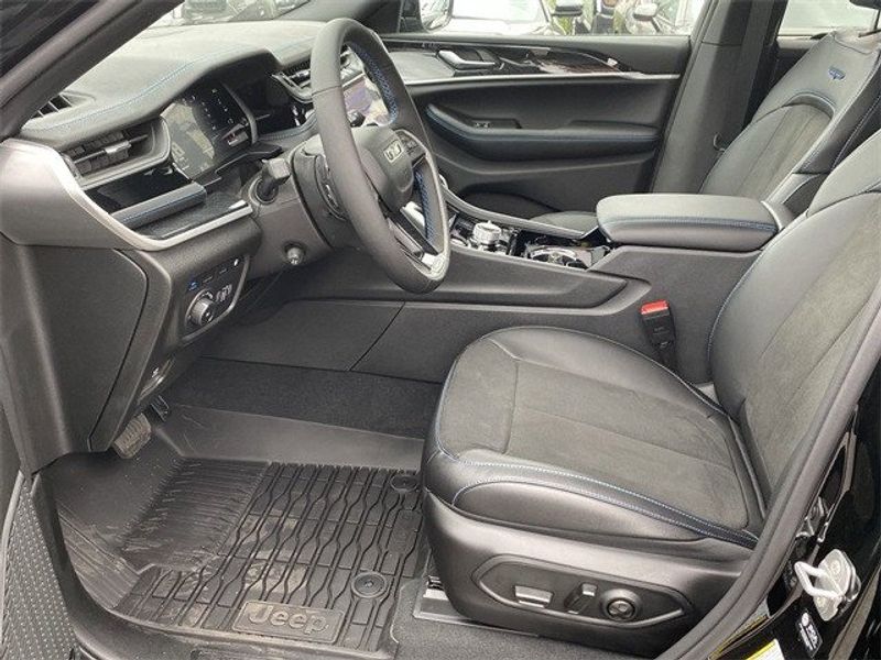 2023 Jeep Grand Cherokee Trailhawk 4xe in a Diamond Black Crystal Pearl Coat exterior color and Global Blackinterior. McPeek