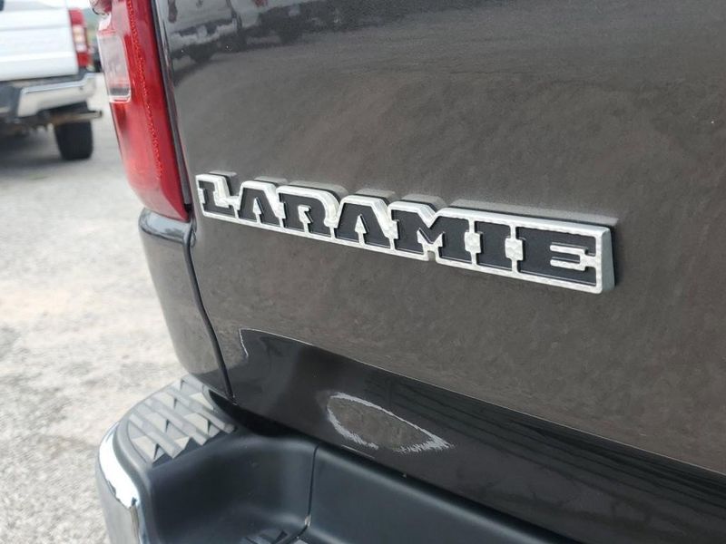 2020 RAM 1500 Laramie in a Granite Crystal Metallic Clear Coat exterior color and Blackinterior. Johnson Dodge 601-693-6343 pixelmotiondemo.com 