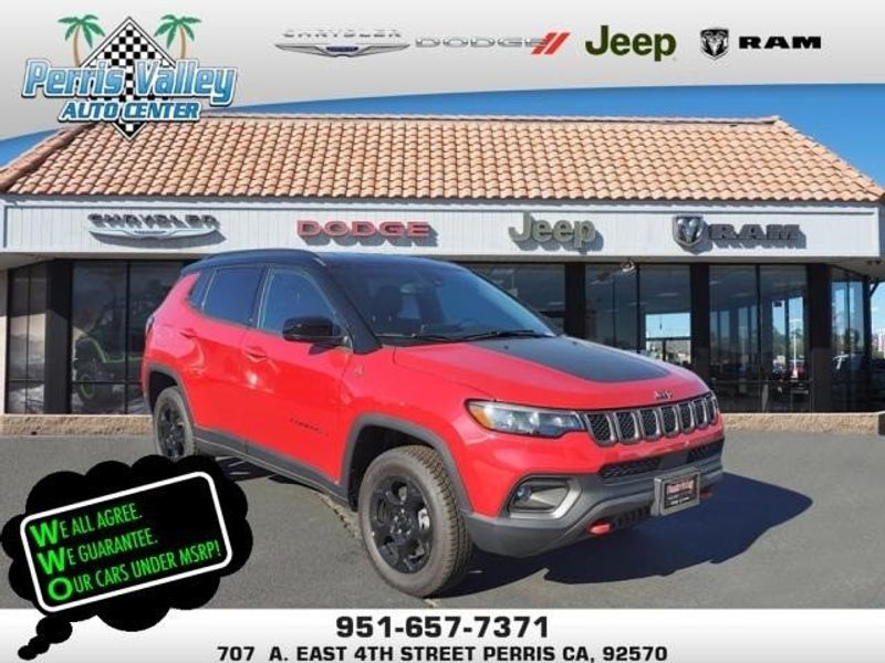 2024 Jeep Compass Trailhawk in a Prm exterior color and Ruby Red/Blackinterior. Perris Valley Auto Center 951-657-6100 perrisvalleyautocenter.com 