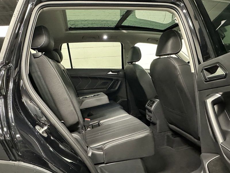 2023 Volkswagen Tiguan SE w/Sunroof & 3rd Row in a Deep Black Pearl exterior color and Black Heated Seatsinterior. Schmelz Countryside Alfa Romeo and Fiat (651) 968-0556 schmelzfiat.com 
