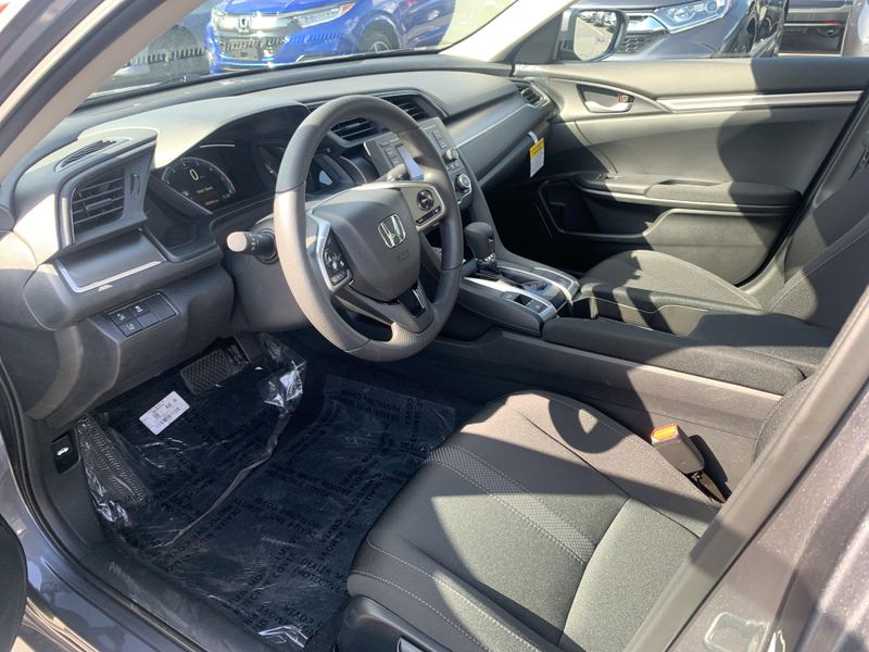2020 Honda Civic Sedan LX in a White exterior color. BEACH BLVD OF CARS beachblvdofcars.com 
