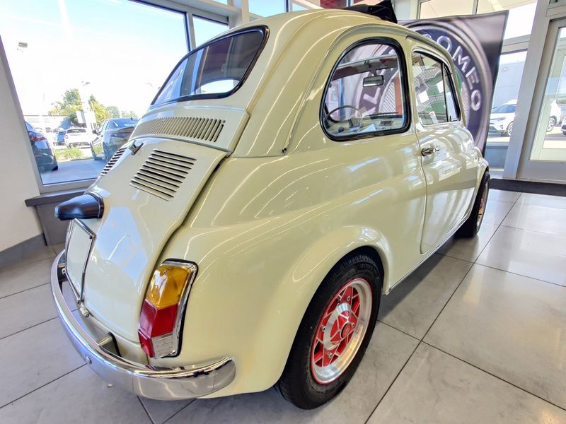1967 Fiat 500 Model F w/al Fresco Top in a White exterior color and Redinterior. Schmelz Countryside SAAB (888) 558-1064 stpaulsaab.com 