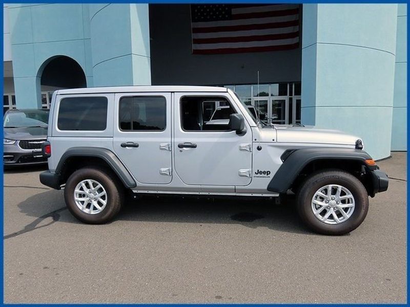 2023 Jeep Wrangler Sport in a Silver Zynith Clear Coat exterior color and Blackinterior. Papas Jeep Ram In New Britain, CT 860-356-0523 papasjeepram.com 