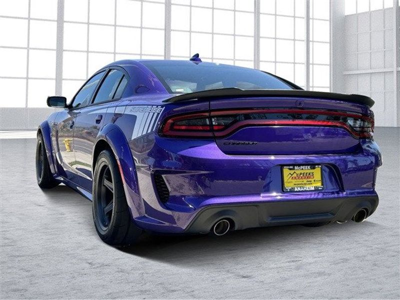 2023 Dodge Charger Super Bee in a Plum Crazy exterior color and Carboninterior. McPeek