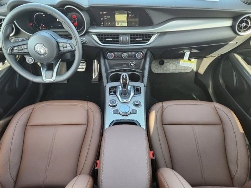 2024 Alfa Romeo Stelvio Ti Awd in a Vesuvio Gray Metallic exterior color and Chocolateinterior. Northside Alfa Romeo of Houston 281-475-4549 alfaromeousaofnorthhouston.com 