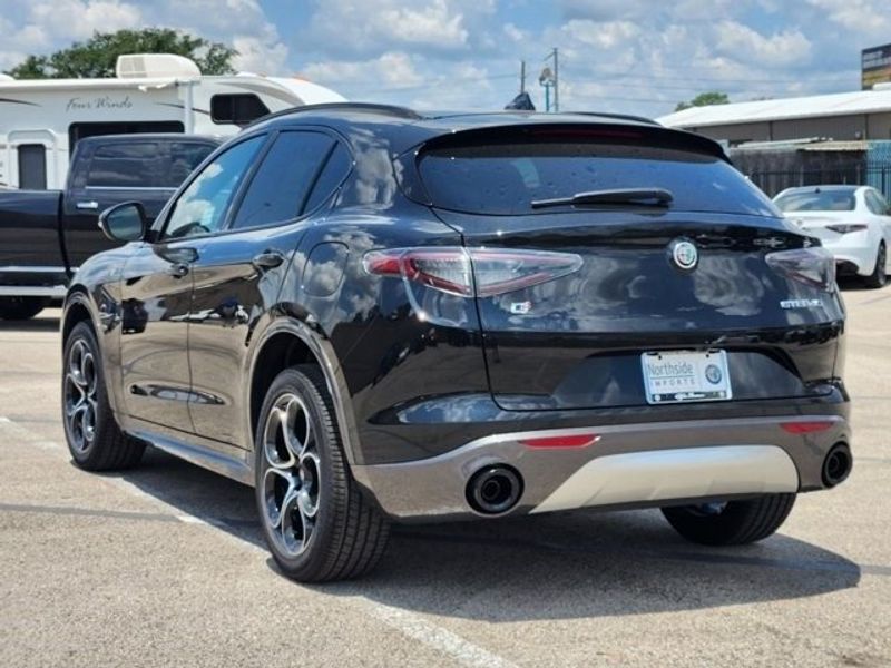 2024 Alfa Romeo Stelvio Ti in a Vulcano Black Metallic exterior color and Chocolateinterior. Northside Imports Houston 281-475-4549 northsideimportshouston.com 