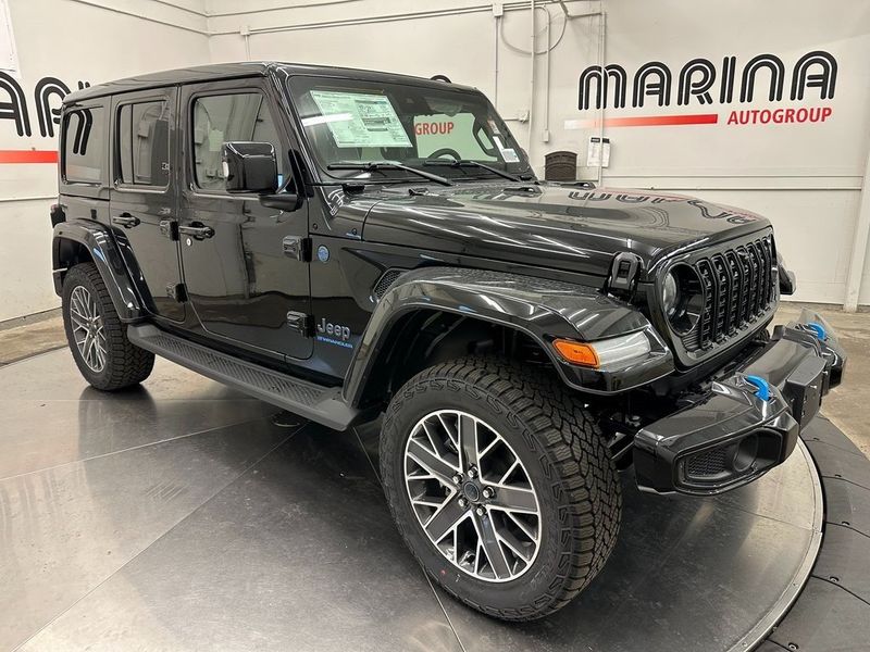 2024 Jeep Wrangler 4-door High Altitude 4xe in a Black Clear Coat exterior color and Green/Blackinterior. Marina Auto Group (855) 564-8688 marinaautogroup.com 