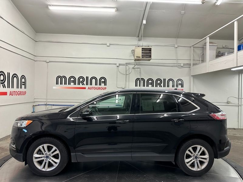 2020 Ford Edge SEL in a Agate Black exterior color and Ebonyinterior. Marina Chrysler Dodge Jeep RAM (855) 616-8084 marinadodgeny.com 