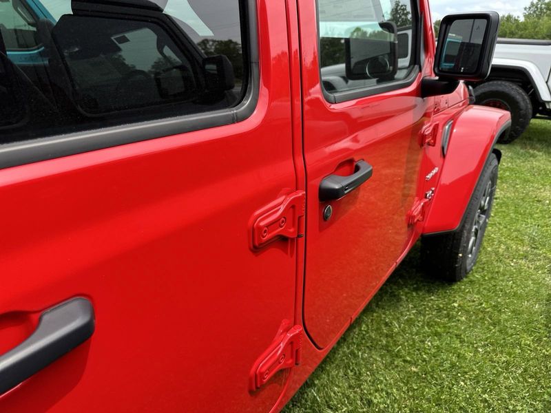 2024 Jeep Wrangler 4-door Sahara in a Firecracker Red Clear Coat exterior color. Gupton Motors Inc 615-384-2886 guptonmotors.com 