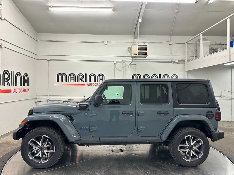 2024 Jeep Wrangler 4-door Sport S 4xe in a Anvil Clear Coat exterior color and Blackinterior. Marina Auto Group (855) 564-8688 marinaautogroup.com 