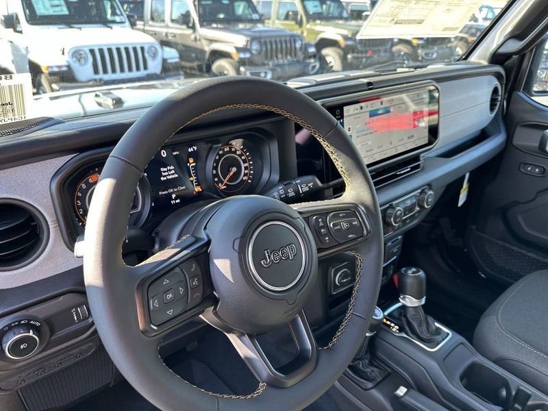 2024 Jeep Wrangler 4-door Sport S in a Black Clear Coat exterior color and Blackinterior. Gupton Motors Inc 615-384-2886 guptonmotors.com 