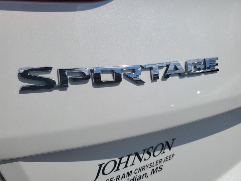 2021 Kia Sportage LX in a Snow White Pearl exterior color and Blackinterior. Johnson Dodge 601-693-6343 pixelmotiondemo.com 