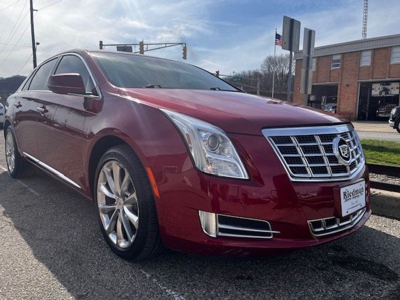 2013 Cadillac XTS  in a RED exterior color. Riedman Motors Co family owned since 1926 "From our lot, to your driveway" (765) 222-5358 riedmanmotors.net 