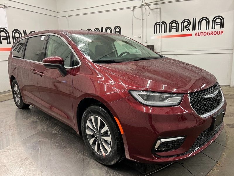 2023 Chrysler Pacifica Plug-in Hybrid Touring L in a Velvet Red Pearl Coat exterior color and Blackinterior. Marina Auto Group (855) 564-8688 marinaautogroup.com 