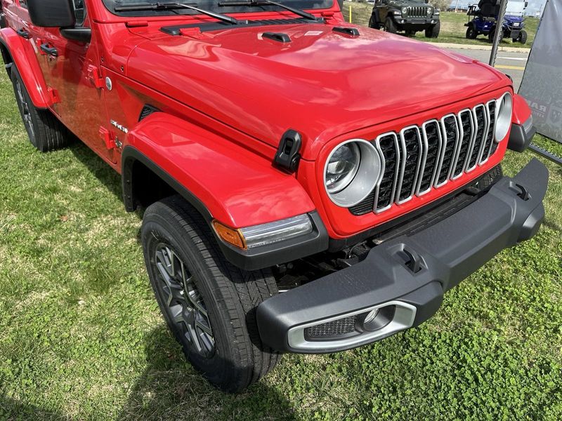 2024 Jeep Wrangler 4-door Sahara in a Firecracker Red Clear Coat exterior color. Gupton Motors Inc 615-384-2886 guptonmotors.com 