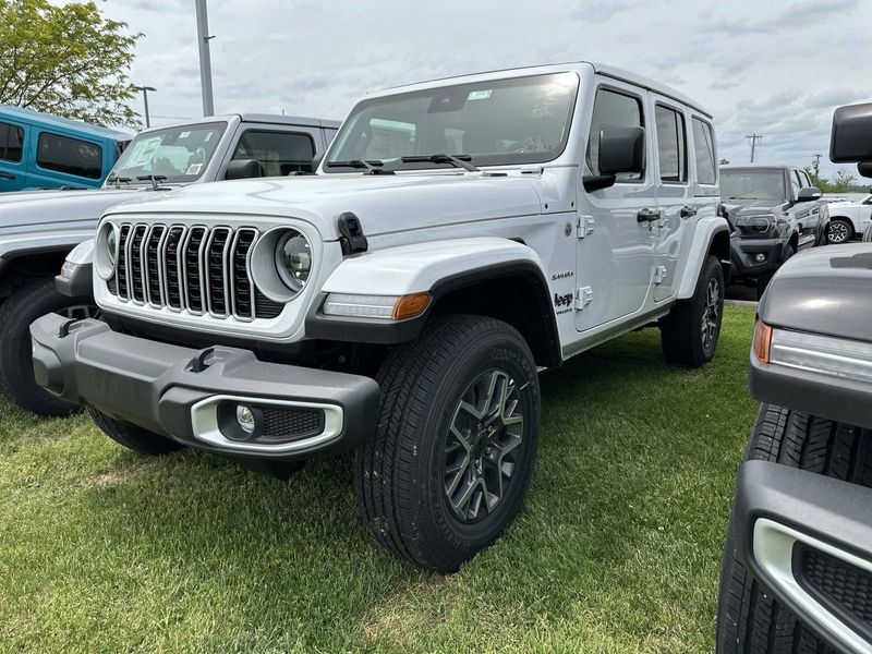 2024 Jeep Wrangler 4-door Sahara in a Bright White Clear Coat exterior color. Gupton Motors Inc 615-384-2886 guptonmotors.com 