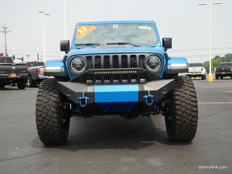 2023 Jeep Wrangler Rubicon 4xe in a Hydro Blue Pearl Coat exterior color and Black/Dark Saddleinterior. Paul Sherry Chrysler Dodge Jeep RAM (937) 749-7061 sherrychrysler.net 