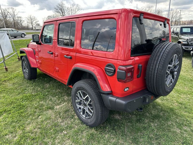 2024 Jeep Wrangler 4-door Sahara in a Firecracker Red Clear Coat exterior color. Gupton Motors Inc 615-384-2886 guptonmotors.com 