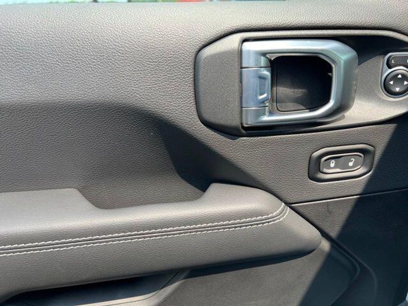 2023 Jeep Wrangler Sahara 4xe in a Silver Zynith Clear Coat exterior color and Blackinterior. Lakeshore CDJR Seaford 302-213-6058 lakeshorecdjr.com 