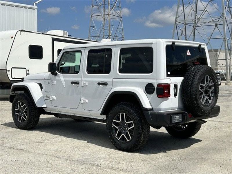 Jeep Wrangler 4xE Sahara in a Bright White Clear Coat exterior color and Blackinterior. McPeek