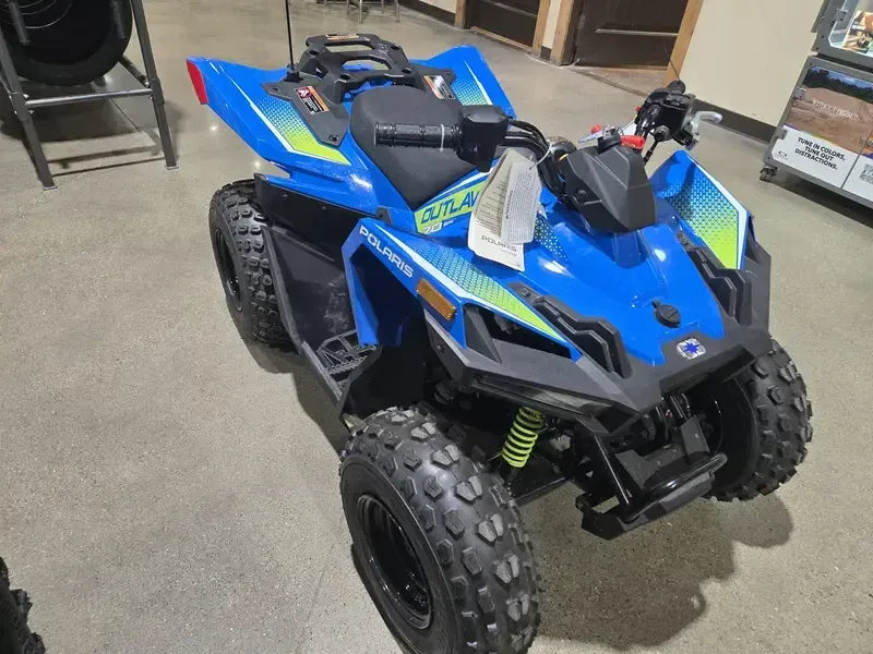 2025 Polaris OUTLAW 70 EFI VELOCITY BLUE AND LIFTED LIME Image 1