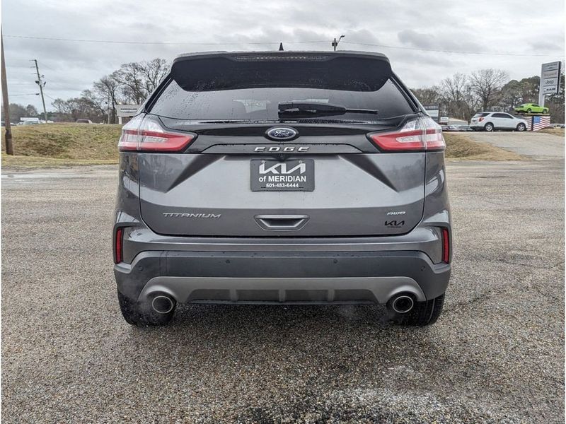 2022 Ford Edge Titanium in a Carbonized Gray Metallic exterior color and Medium Soft Ceramicinterior. Johnson Dodge 601-693-6343 pixelmotiondemo.com 