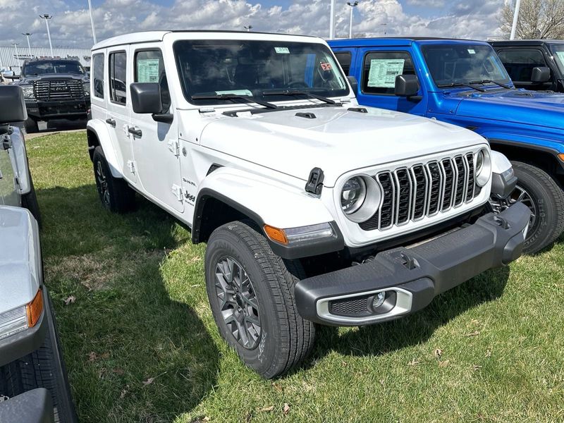 2024 Jeep Wrangler 4-door Sahara in a Bright White Clear Coat exterior color. Gupton Motors Inc 615-384-2886 guptonmotors.com 