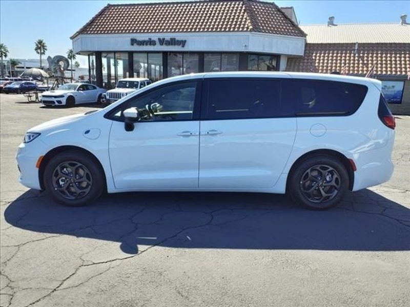 2023 Chrysler Pacifica Hybrid Touring L in a Bright White Clear Coat exterior color and Blackinterior. Perris Valley Kia 951-657-6100 perrisvalleykia.com 