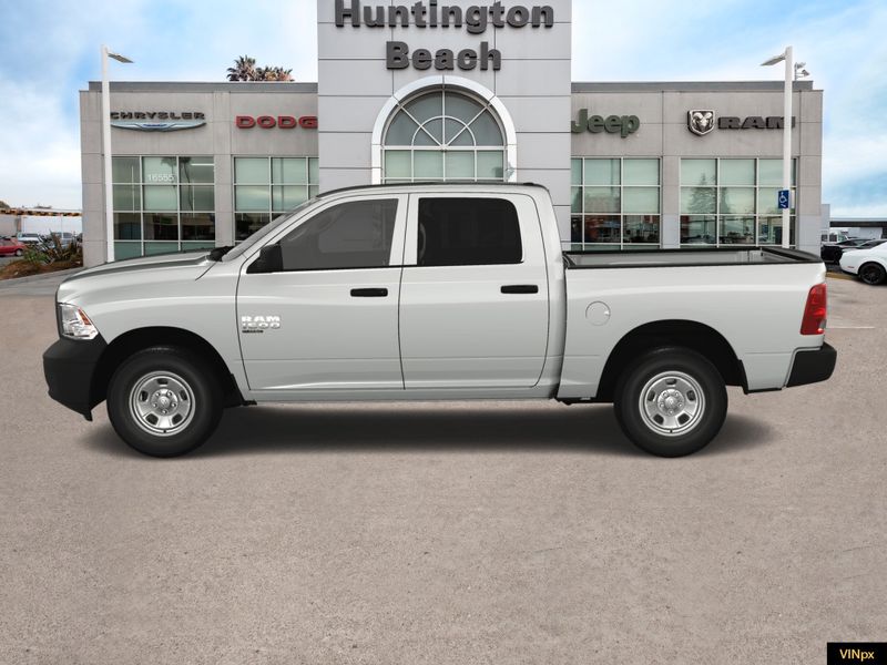 2023 RAM 1500 Classic Tradesman Crew Cab 4x4 in a Bright White exterior color and Blackinterior. BEACH BLVD OF CARS beachblvdofcars.com 