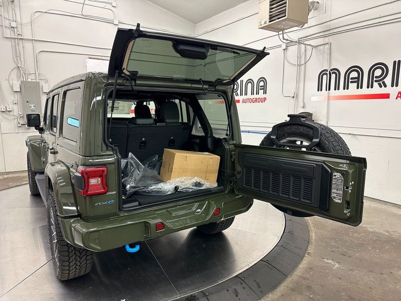 2024 Jeep Wrangler 4-door High Altitude 4xe in a Sarge Green Clear Coat exterior color and Green/Blackinterior. Marina Auto Group (855) 564-8688 marinaautogroup.com 