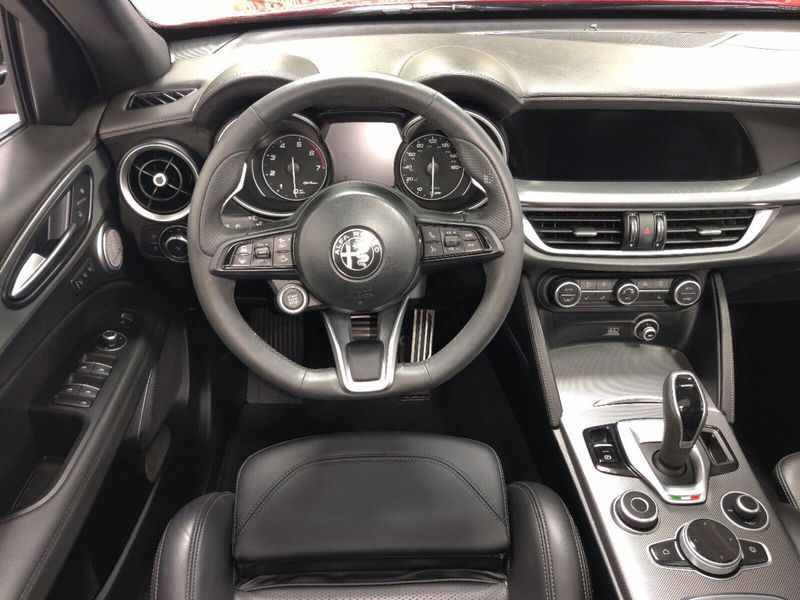 2023 Alfa Romeo Stelvio Veloce Q4 AWD w/Prem & Activ Pkg in a Rosso Etna exterior color and Black Heated Sport Leatherinterior. Schmelz Countryside Alfa Romeo and Fiat (651) 968-0556 schmelzfiat.com 