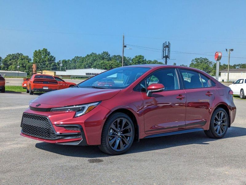 2023 Toyota Corolla SE in a Ruby Flare Pearl exterior color and Black/Redinterior. Johnson Dodge 601-693-6343 pixelmotiondemo.com 