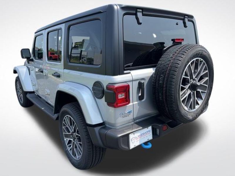 2023 Jeep Wrangler Sahara 4xe in a Silver Zynith Clear Coat exterior color and Blackinterior. Lakeshore CDJR Seaford 302-213-6058 lakeshorecdjr.com 