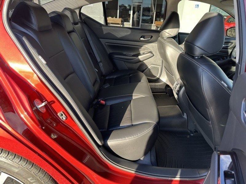 2021 Nissan Altima 2.5 SL in a Scarlet Ember Tint Coat exterior color and Charcoalinterior. Randall Dodge Chrysler Jeep 877-790-6380 randalldodgechryslerjeep.com 