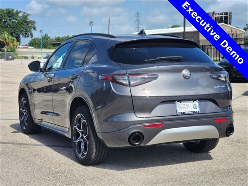 2024 Alfa Romeo Stelvio Ti in a Vesuvio Gray Metallic exterior color and Chocolateinterior. Northside Imports Houston 281-475-4549 northsideimportshouston.com 